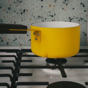 a yellow pot on a table